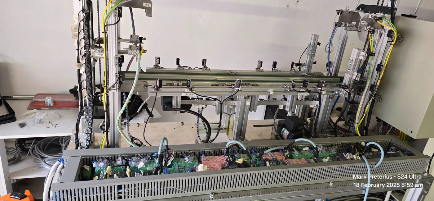 Automated production machine with sensors and controls